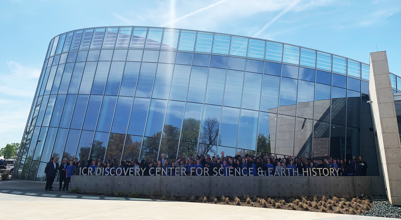 School Group posing behind ICR Discovery Center for Science & Earth History sign.